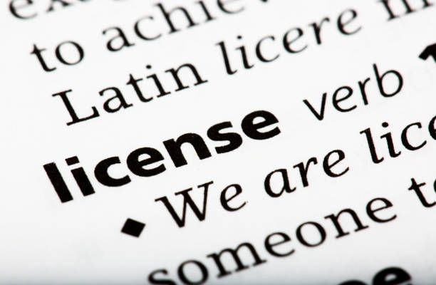 The word license and definition printed in the English dictionary The word license and definition printed in the English dictionary Driving License Translation stock pictures, royalty-free photos & images