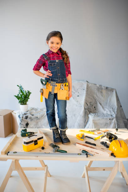 istock Little girl in tool belt 684071958