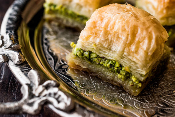 istock Turkish Dessert Baklava with pistachio on silver tray. 684078800