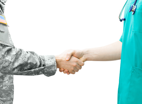 Soldier and doctor shaking hands