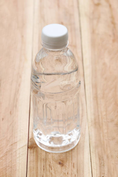 istock Plastic of Water bottles on wooden floor. 684085800