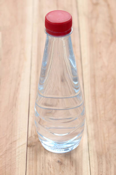 istock Plastic of Water bottles on wooden floor. 684085830