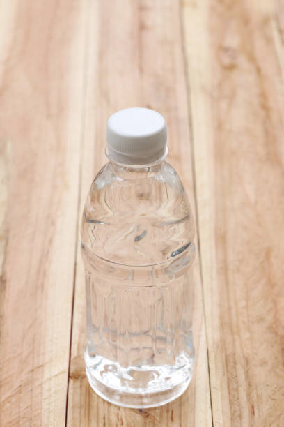 istock Plastic of Water bottles on wooden floor. 684085864