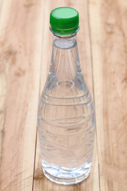 istock Plastic of Water bottles on wooden floor. 684085922