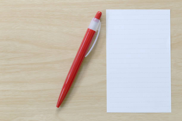 istock Note paper and red pen placed on wooden floor. 684086452