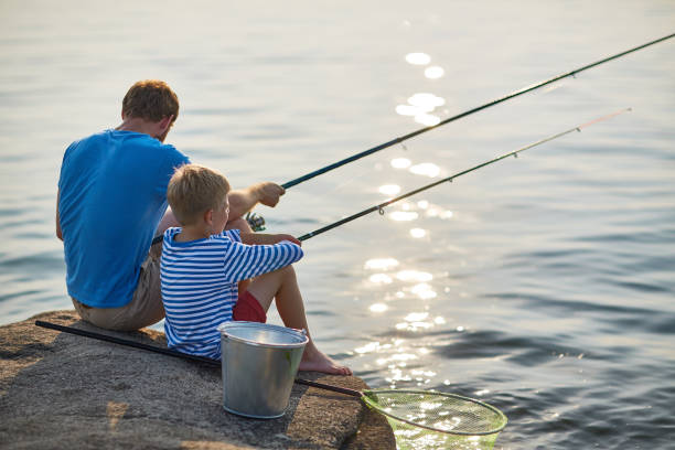 istock Father and Son Fishing on Lake 684090182