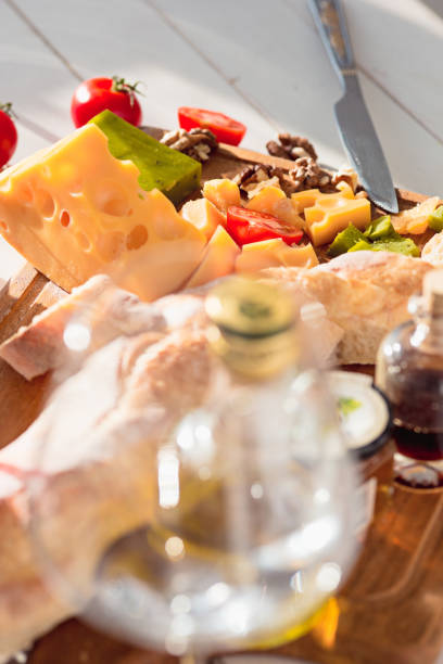 istock Wine, baguette and cheese on wooden background 684090408