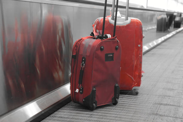 istock suitcase on a pedestrian conveyor belt at the airport 684090444
