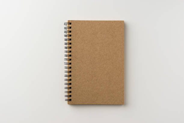 istock Top view of spiral blank notebook on white background 684097248