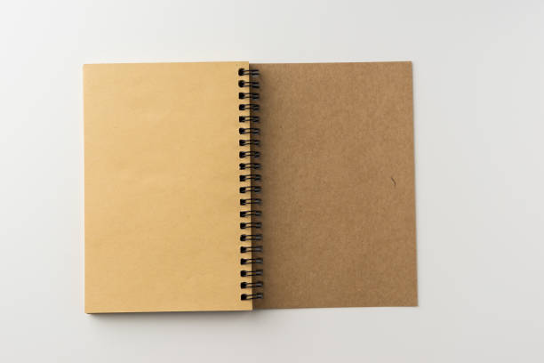 istock Top view of spiral blank notebook on white background 684097300