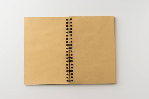 istock Top view of spiral blank notebook on white background 684097366