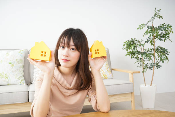 istock Young woman looking for house 684097488