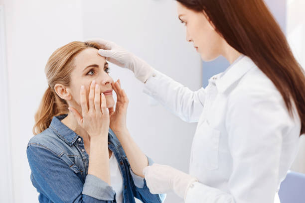 istock Beautiful good looking woman holding her cheeks 684098428