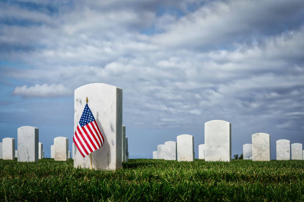 Patriotic 4 A flag on a grave at a southern California cemetery. soldier grave stock pictures, royalty-free photos & images