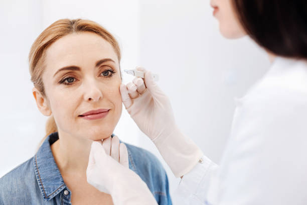 istock Nice delighted woman having her eyebrows plucked 684098538
