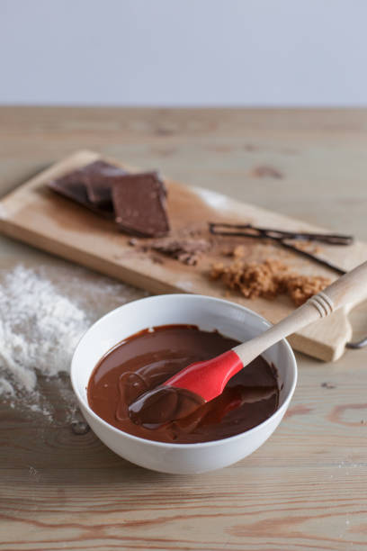 istock Red spatula in a white bowl filled with chocolate brownie mix 684098700
