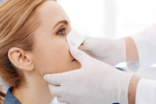 istock Close up of womans face with a medical dressing 684101896
