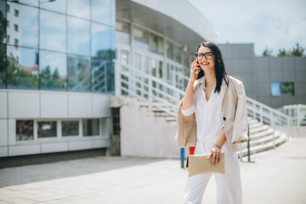 istock Business Women On Phone Walking In A Rush 684102036