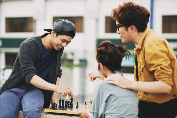 istock Asian Friends Playing Chess 684108608