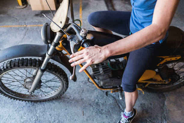 istock Woman Mechanic Check Motorcycle 684116218