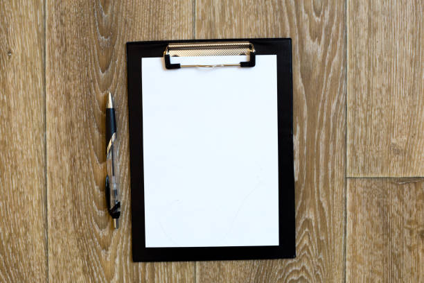 istock Pen and Notepad on the wooden desk 684122136