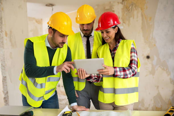 istock Group of architects consult about the project on construction site 684125946