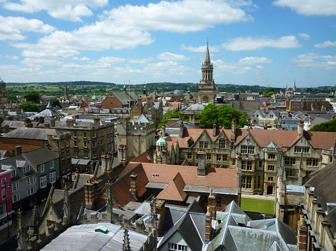 A view of Oxford, England, on a bright summer's day, with a mixture of colleges, chapels, and other buildings of the University of Oxford.