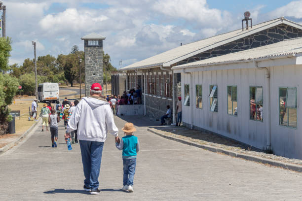 ROBBEN ISLAND, SOUTH AFRICA, 18 December 2016: Llittle boy and grandfather visiting the maximum security prison on Robben Island, where Nelson Mandela was imprisoned