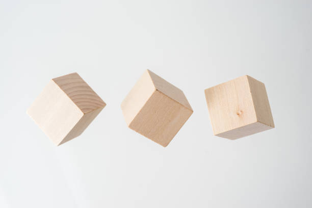 istock Abstract geometric real floating wooden cube on grey background 684133102