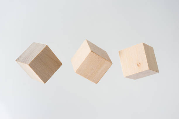 istock Abstract geometric real floating wooden cube on grey background 684133144