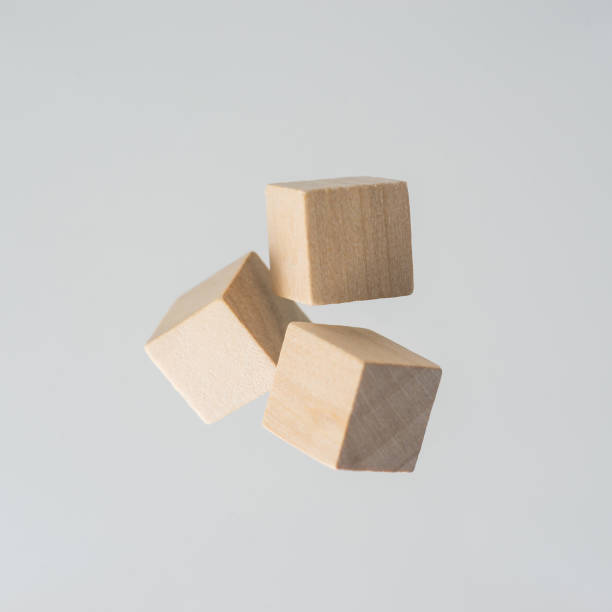 istock Abstract geometric real floating wooden cube on grey background 684133520