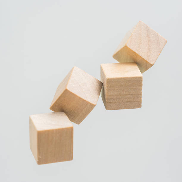 istock Abstract geometric real floating wooden cube on grey background 684133602