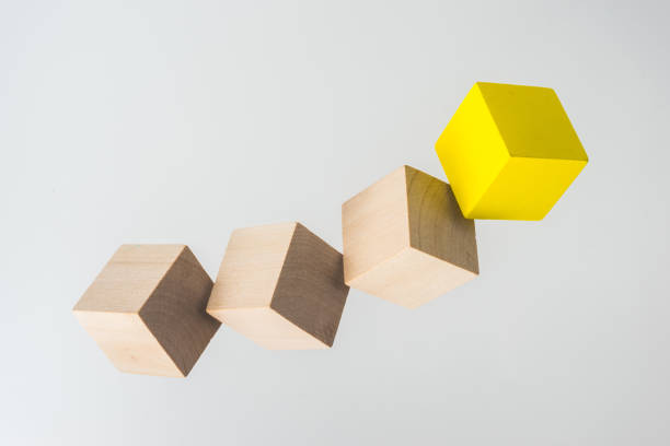 istock Abstract geometric real floating wooden cube on grey background 684133790