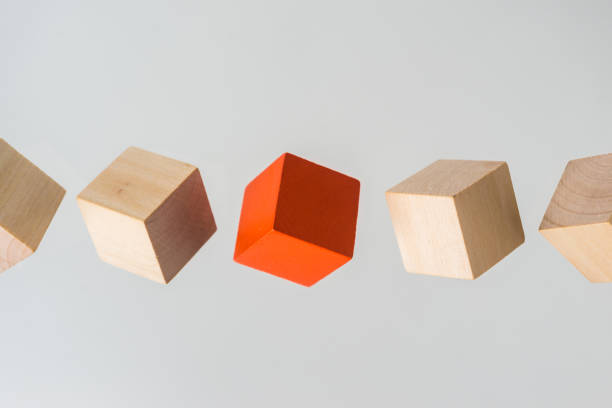 istock Abstract geometric real floating wooden cube on grey background 684134248