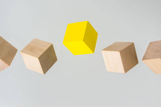 istock Abstract geometric real floating wooden cube on grey background 684134358