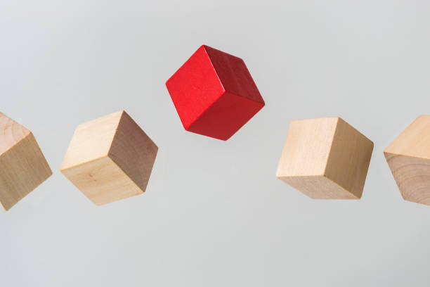 istock Abstract geometric real floating wooden cube on grey background 684134458