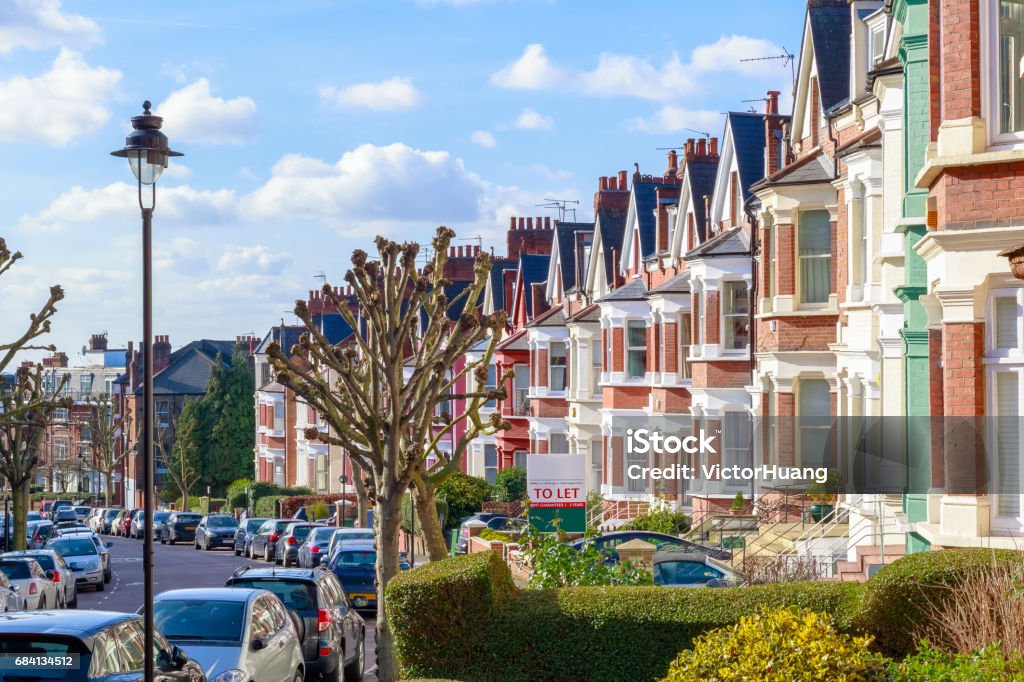 Typical English terraced houses in West Hampstead, London Row of typical English terraced houses in West Hampstead, London with a To Let sign outside Real Estate Stock Photo