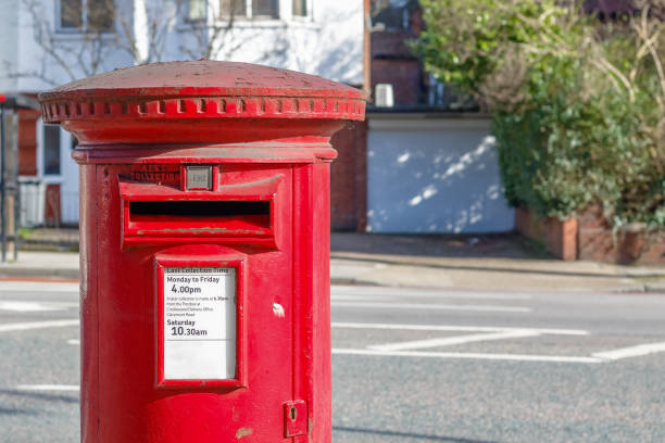 istock Red English post box set against a de-focused street background 684140678