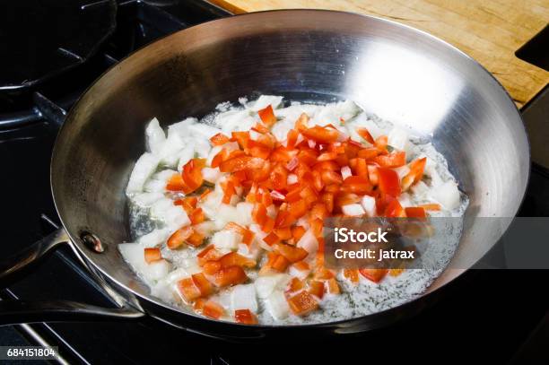Red Peppers And Onions Sauting In Fry Pan Stock Photo - Download Image Now - Appliance, Bell Pepper, Butter
