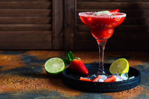 Strawberry daiquiri cocktail Strawberry daiquiri cocktail with lime and ice cubes. Space for text. Top view daiquiri stock pictures, royalty-free photos & images