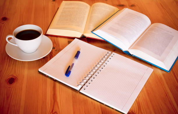 istock Books, blank  notebook, pen and cup of coffee 684152010