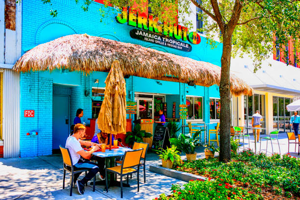 People outside the Jerk Hut Jamaican restaurant in downtown Tampa FL People outside the Jerk Hut Jamaican restaurant in downtown Tampa FL florida food stock pictures, royalty-free photos & images