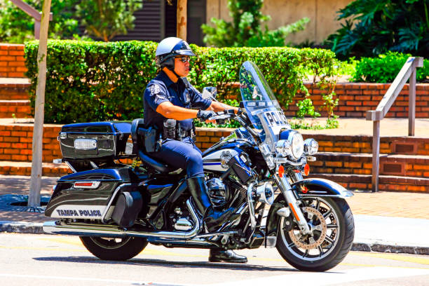 Free Stock Photo of Police Officer Riding Motorcycle Across Street ...