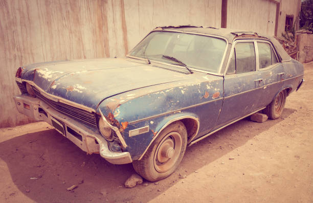 Old rusty car Old vintage rusty car abandoned in a desert town obsolete stock pictures, royalty-free photos & images