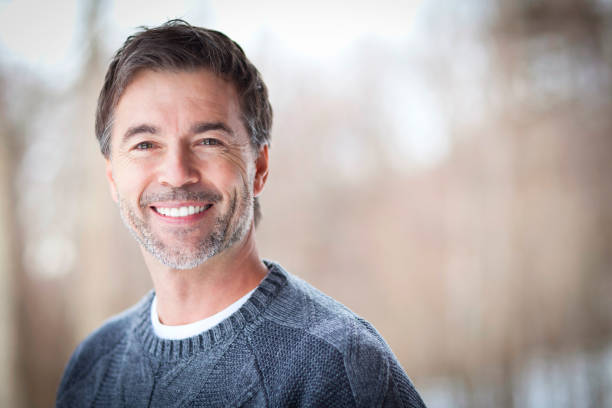 Handsome Mature Happy Man Smiling At The Camera.Outside. stock photo