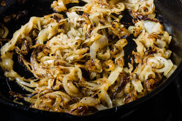 istock Onions carmelizing in cast iron skillet 684167752