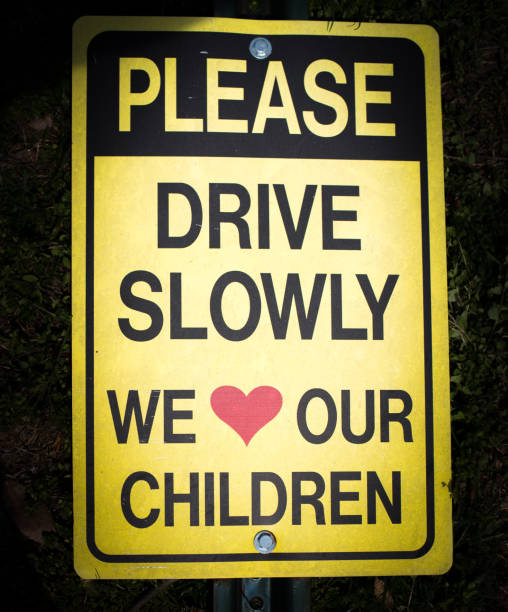 istock please drive slowly we love our children sign 684173504
