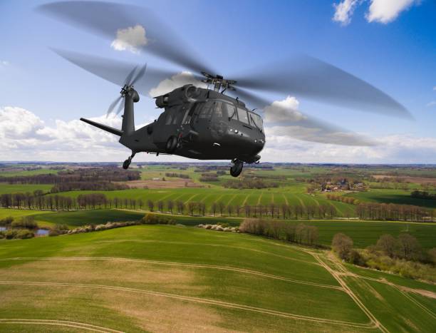 Black Hawk Uh-60 military Helicopter in flight - aerial view close up