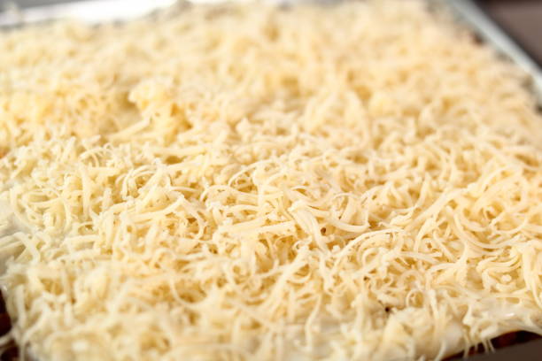 istock Grated cheese on top layer. Making Lasagna Bolognese Series. 684174020