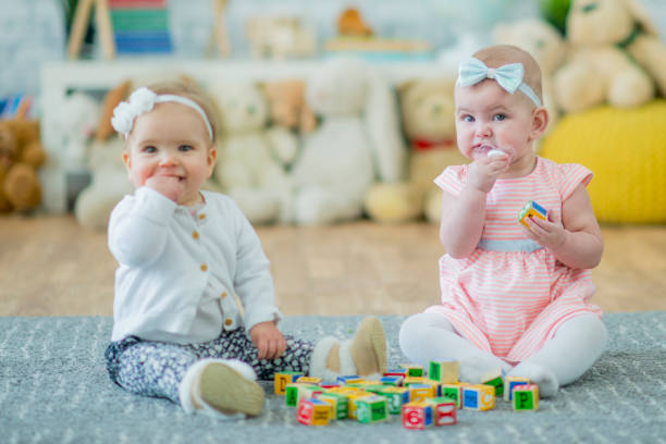 istock Two Baby Sisters Playing with Toy Blocks 684178300